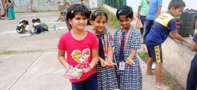 1st standard students making ganpati  