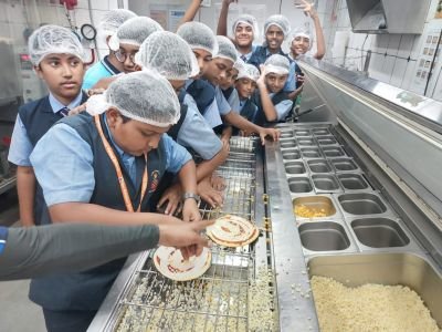 Nav Krishna Valley School's Visit to the Dominos ????

31st Jan: Suraj Foundation’s Nav Krishna Valley School (EM), Kupwad organized an exciting educational visit to Domino’s in Sangli as part of their Bagless Day initiative. The event aimed to give students an opportunity to learn about pizza-making while promoting environmental consciousness by encouraging a bagless day. 

The students from Classes 4 to 8 took part in an engaging Junior Pizza Chef session, where they got the chance to create their own pizzas. The hands-on experience allowed them to explore the different steps involved in pizza preparation, from choosing toppings to baking. This was not only fun but also an educational experience, as the students learned about hygiene, food safety, and the art of pizza-making.
The students were also treated to an interactive Q&A session with the staff, which sparked a great deal of interest and curiosity.

The visit was met with overwhelming enthusiasm and positive feedback from both students and teachers. 

The school visit to Domino’s proved to be a fantastic experience for all involved. Nav Krishna Valley School looks forward to organizing more such events that blend learning with fun, contributing to the holistic development of its students.